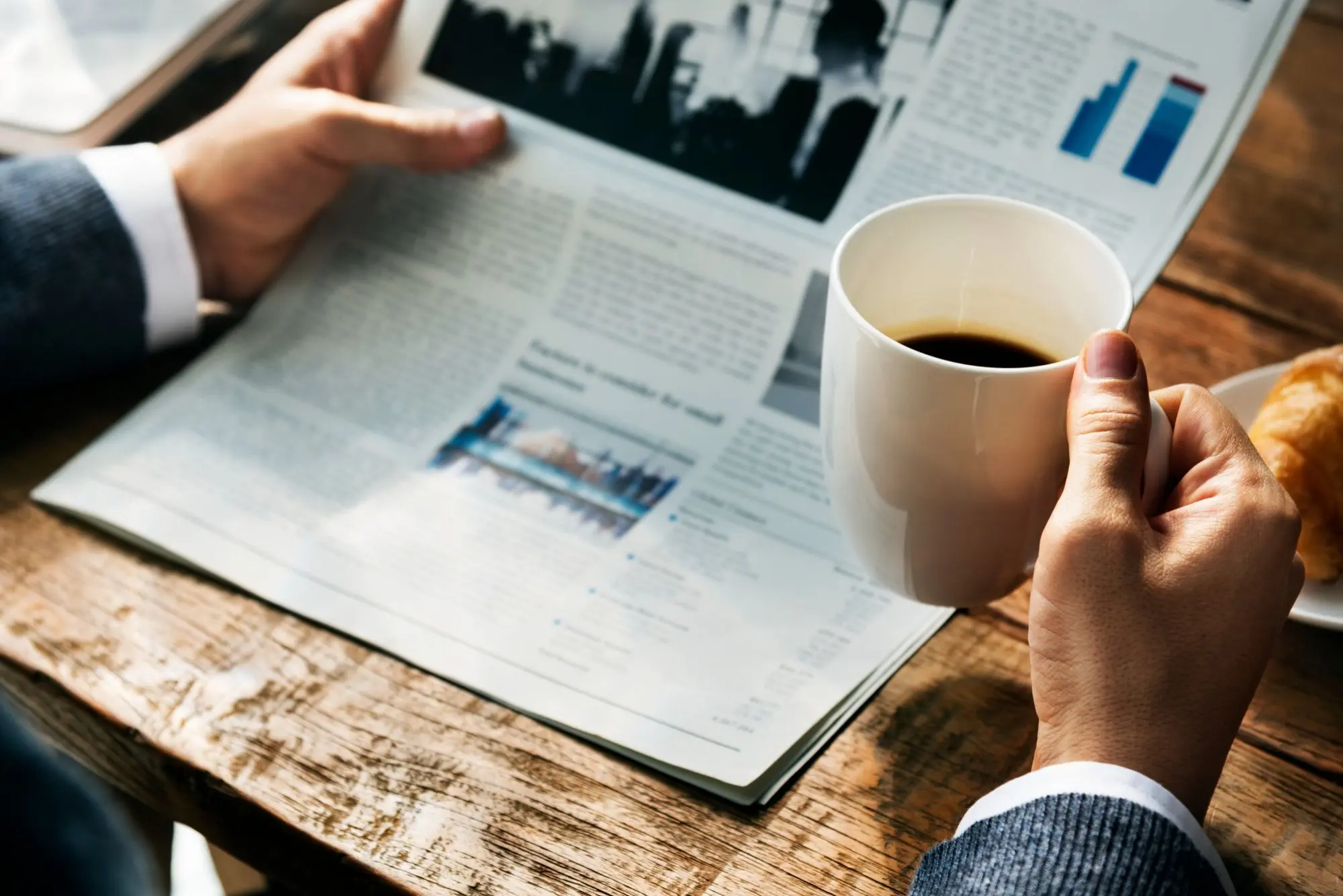 Person reading newspaper