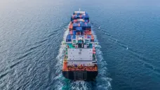 Aerial view of freighter at sea away