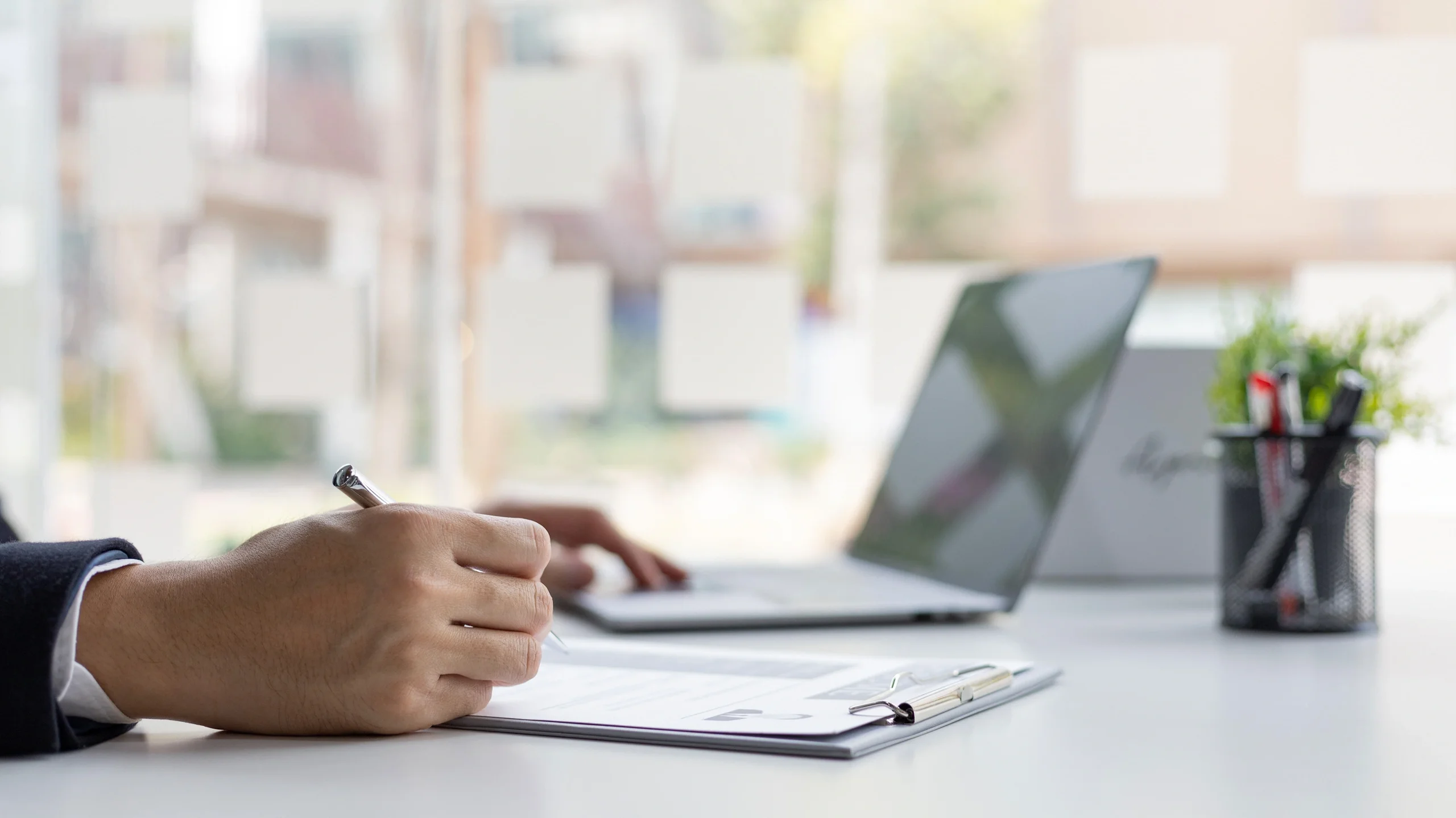 Man working at desk with laptop