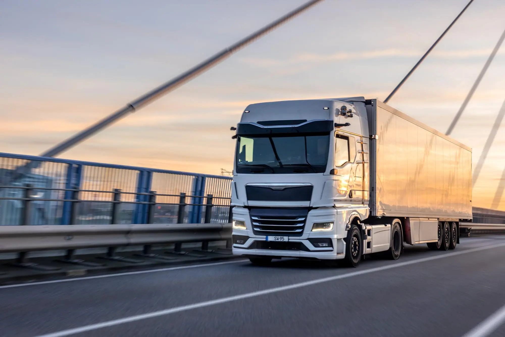 White Truck crossing bridge